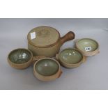 A quantity of St Ives Pottery including a casserole pot and four celadon glazed bowls