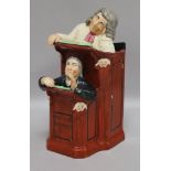 A Staffordshire figure group, 'The Preacher and Moses' height 24cm