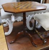 A mahogany games table on tripod base W.60cm.