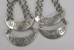 A set of 4 Victorian silver sauce labels by Charles Stuart Harris Anchovy, Harvey, Vinegar &