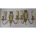 A pair of Louis XVI gilded bronze two branch mirrored sconces height 27cm