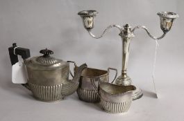 A silver three-piece tea service and a two-branch candelabra