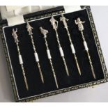 A cased set of six 1970's silver "Dickensian" cherry sticks, 93mm.