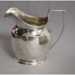 An Edwardian silver helmet shaped cream jug, Nathan & Hayes, Chester, 1907, 5 oz.