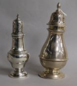 Two George V silver sugar casters, tallest 17cm, 6 oz.