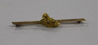 A yellow metal nugget bar brooch, 66mm.