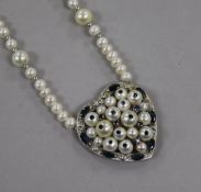 A modern 14ct white gold and gem set cultured pearl heart shaped pendant necklace, 42cm.