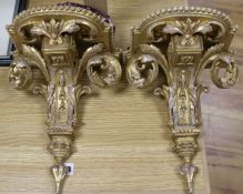 A pair of gilt wall brackets