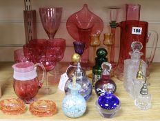 A quantity of coloured glass and scent bottles