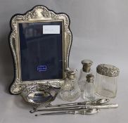 Mixed silver including a photograph frame, toilet jars and a bonbon dish.