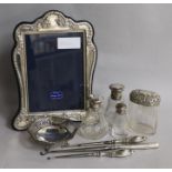 Mixed silver including a photograph frame, toilet jars and a bonbon dish.