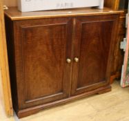 A Victorian mahogany two door cupboard W.112cm