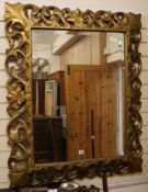 A large ornate gilt wall mirror W.94cm