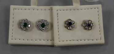 A pair of 18ct white gold, emerald and diamond cluster ear studs and a pair of 18ct gold, sapphire