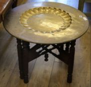 An Indian brass tray top table