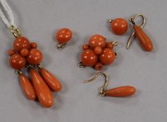 A yellow metal and coral drop pendant, a pair of coral earrings and another coral pendant,
