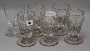 A set of four early half pint glasses and another square base glass height 14.5cm
