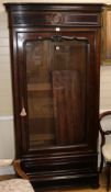 A mid 19th century French rosewood bookcase, enclosed by a single glazed door, H.216cm W.106cm W: