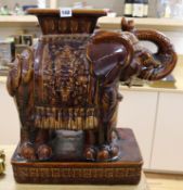 A Chinese brown glazed elephant garden seat height 56cm width 54cm