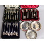 Three cased sets including two silver and three small silver commemorative dishes.