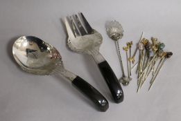 A set of twelve 1930's parcel gilt silver cocktail sticks, one other set of six, a pair of Malaysian