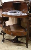 A George III mahogany two tier bowfronted wash stand, fitted with later cut glass bowls W.70cm