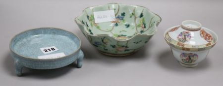 A Chinese celadon glazed dish, a Jun type tripod dish and a famille rose bowl and cover