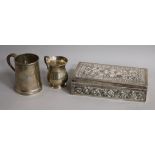 Two silver christening mugs and a white metal cigarette box.