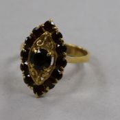 An 18ct gold and garnet set marquise cluster ring, size N.