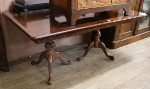 A George III style mahogany two pillar dining table W.162cm