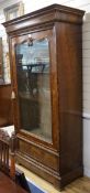 A 19th century French burr walnut bookcase, enclosed by a single glazed door, H.206cm W.107cm H.