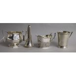 A 1930's stylish silver mug, a silver sugar bowl, a silver cream jug and a silver candle snuffer.