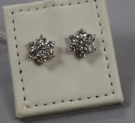 A modern pair of 18ct white gold and diamond cluster flower head earrings, 8mm.