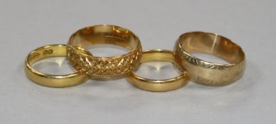 Two 22ct gold bands, an 18ct gold band and a 9ct gold band.