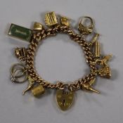A 9ct gold curb-link charm bracelet hung with 17 charms, 61.6g gross