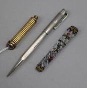 A silver yard o'lead pen, needle case and a propelling pencil