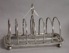 A George V silver seven bar toast rack, Charles Stuart Harris & Sons, London, 1918, 15.1cm, 7 oz.