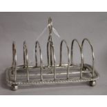 A George V silver seven bar toast rack, Charles Stuart Harris & Sons, London, 1918, 15.1cm, 7 oz.