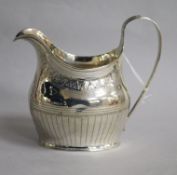 A George III silver helmet shaped cream jug, London, 1903, 11cm.