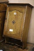 An oak smoker's cabinet W.36cm