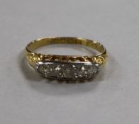 A George V 18ct gold and five stone diamond ring, size L.