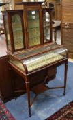 An Edwardian mahogany bijouterie cabinet, fitted plate glass shelves, raised on square tapered
