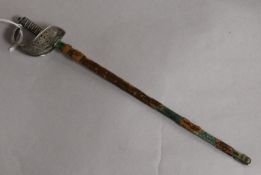 An early 20th century novelty sterling silver letter opener, modelled as a sabre in leather