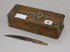An old wooden box with raised floral design width 24cm height 7cm