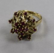 A 14ct gold and ruby set cocktail ring, size M.