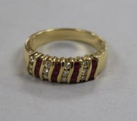 A modern 14ct gold ruby and diamond cluster half hoop ring, size M.