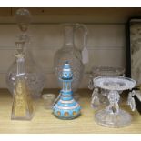 A pair of cut glass tazzas hung with lustres, a decanter and stopper, a claret jug and two scent