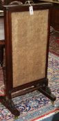 An early Victorian cheval fire screen W.49cm.