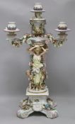 A German porcelain figural candelabrum H.62cm