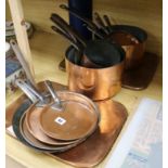 Five various copper pans various lids and a frying pan and two trays